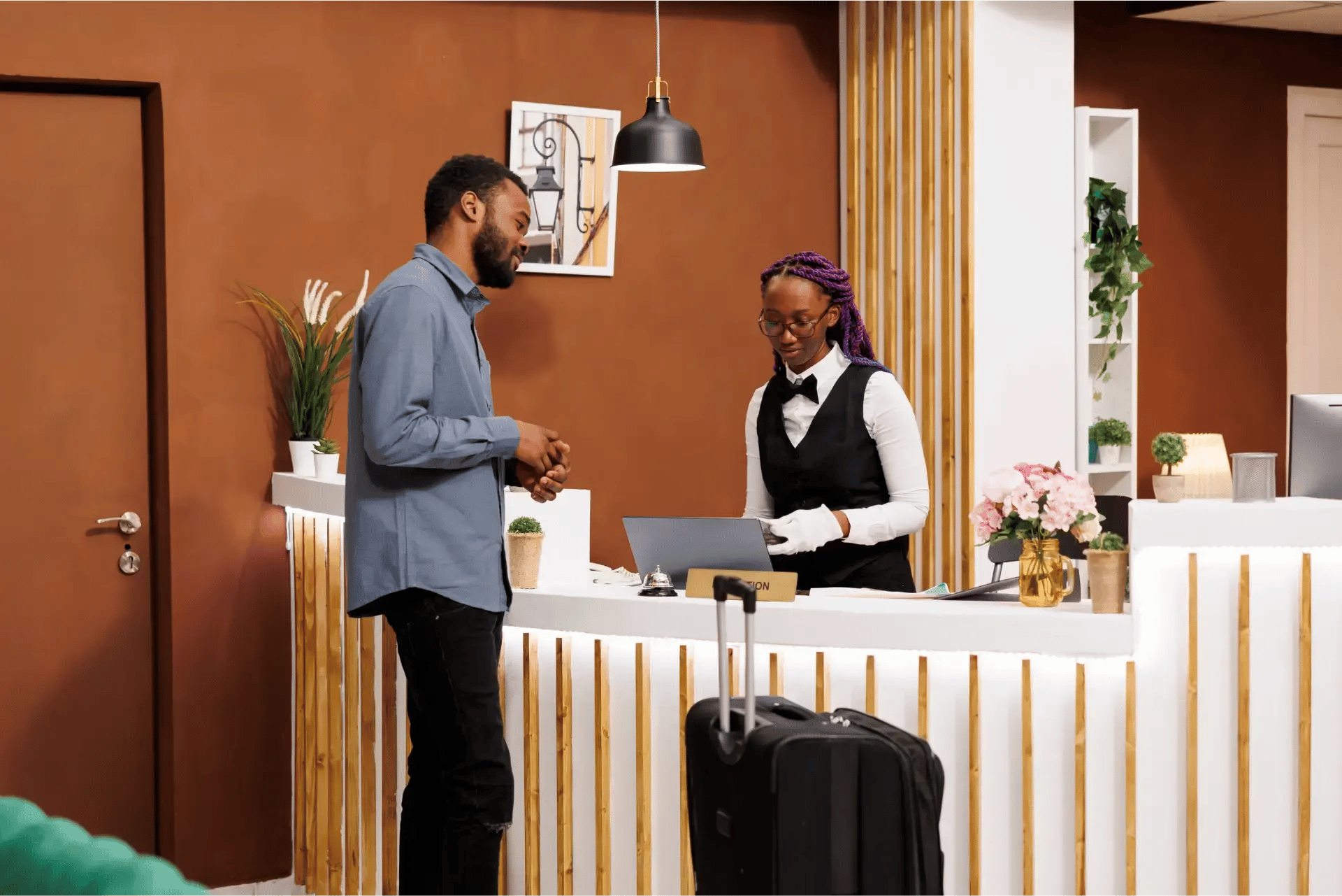 man at hotel front desk